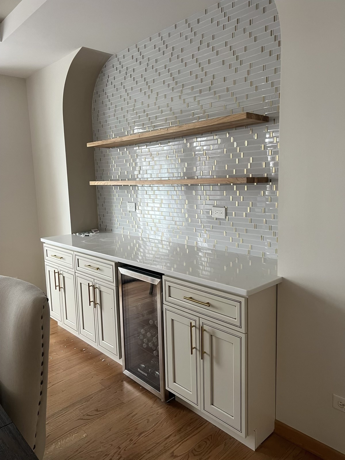 Backsplash tile, floating oak shelves & cabinetry detail