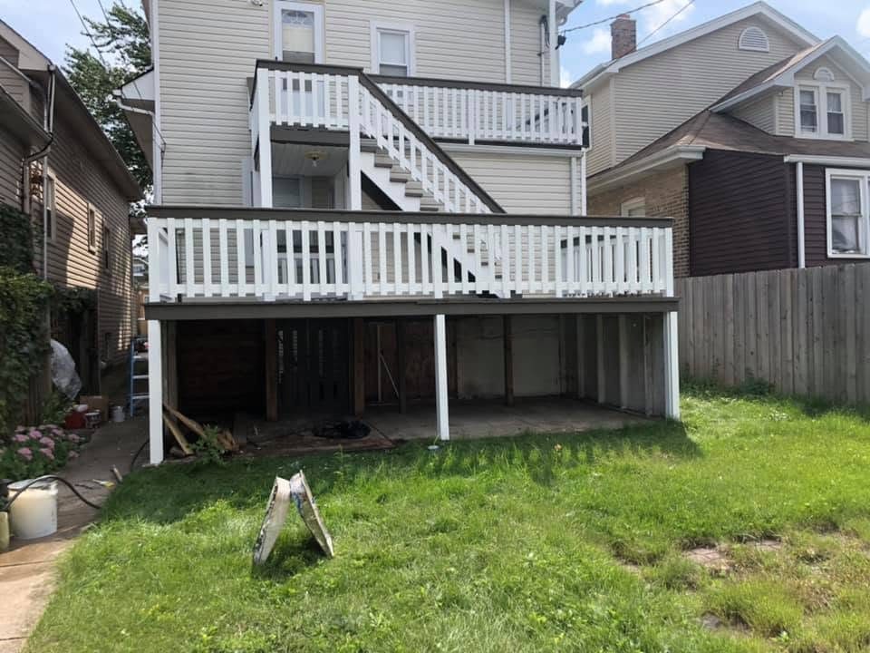 Two-story back porch and staircase, freshly stained